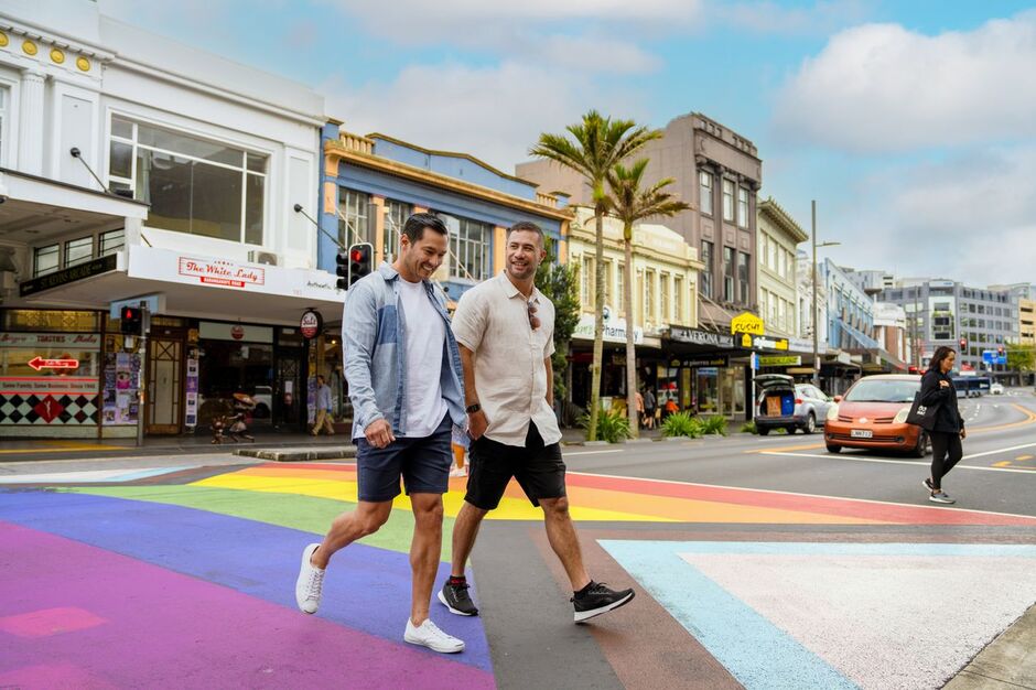Men walking on rainbow crossing Karangahape Road